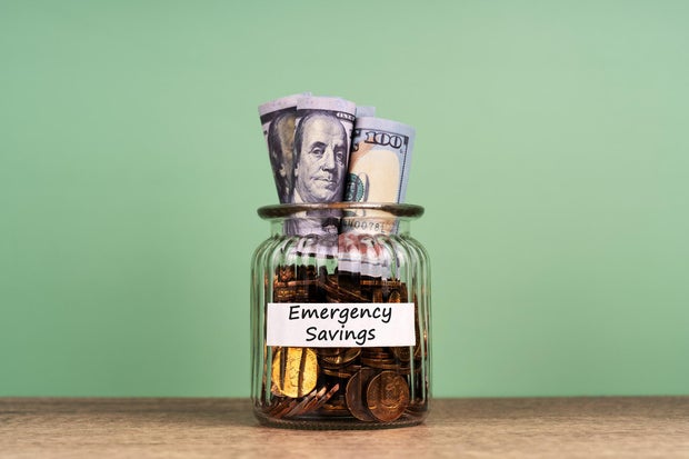 Balancing Debt Repayment and Emergency Savings