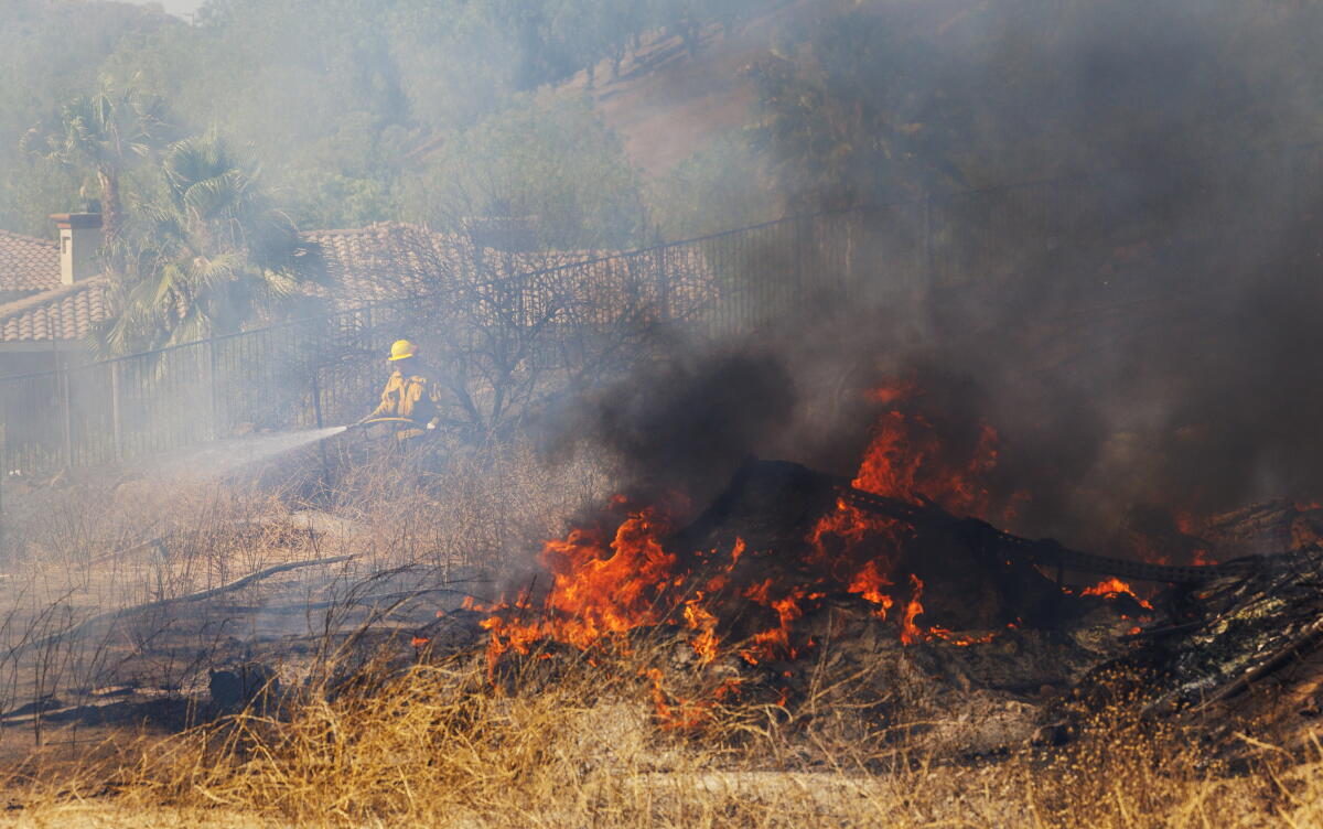 Caught Between Wildfires and Rising Seas